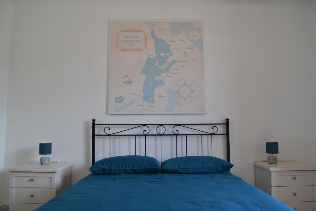 Postel nebo postele na pokoji v ubytování Redipuglia Apartment