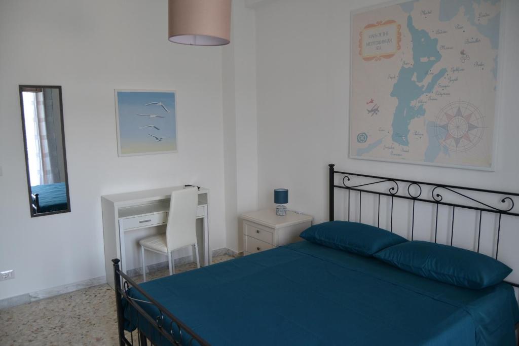 Postel nebo postele na pokoji v ubytování Redipuglia Apartment