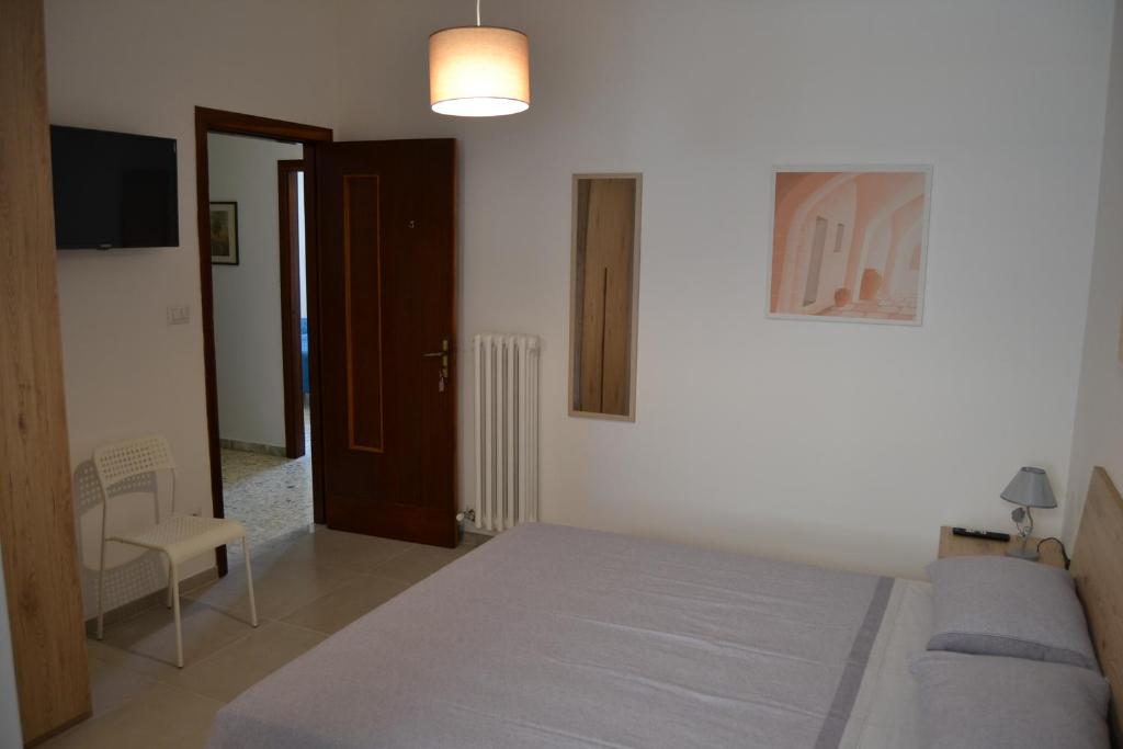Postel nebo postele na pokoji v ubytování Redipuglia Apartment