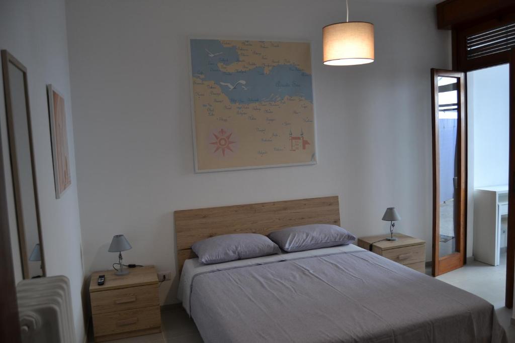 Postel nebo postele na pokoji v ubytování Redipuglia Apartment