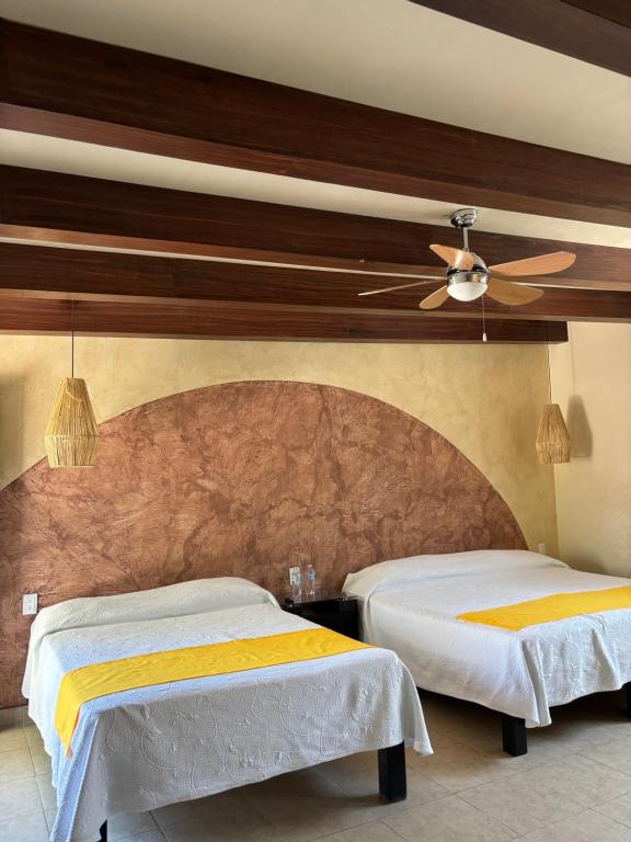 Postel nebo postele na pokoji v ubytování Frutos Hotel