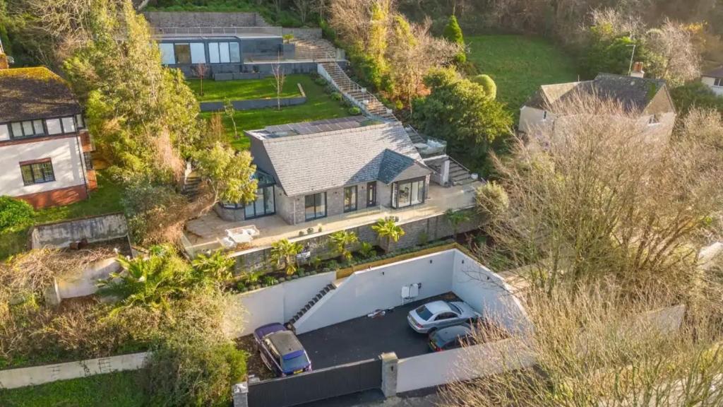 an aerial view of a house with a garage at Foxgloves retreat in Torquay