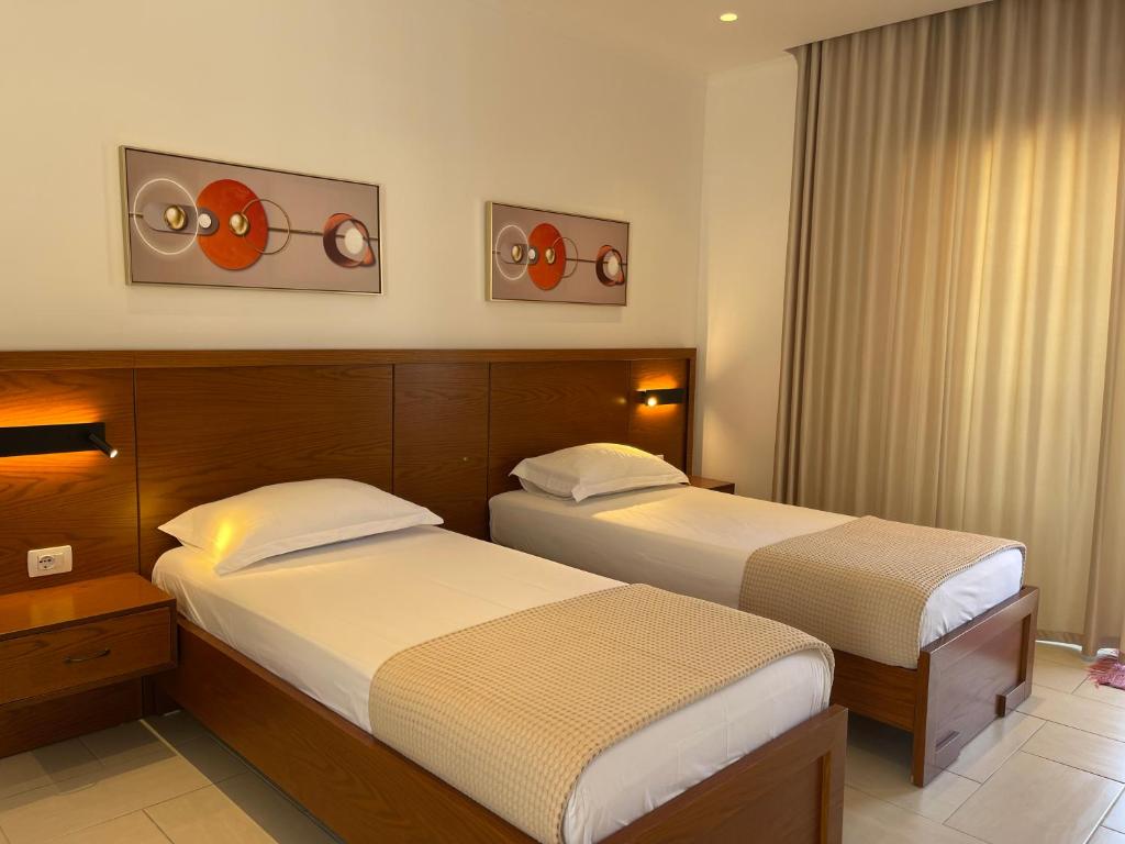 Postel nebo postele na pokoji v ubytování George Apartments