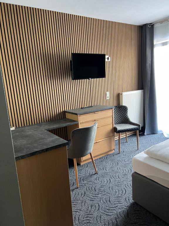 TV a/nebo společenská místnost v ubytování Hotel Aggertal