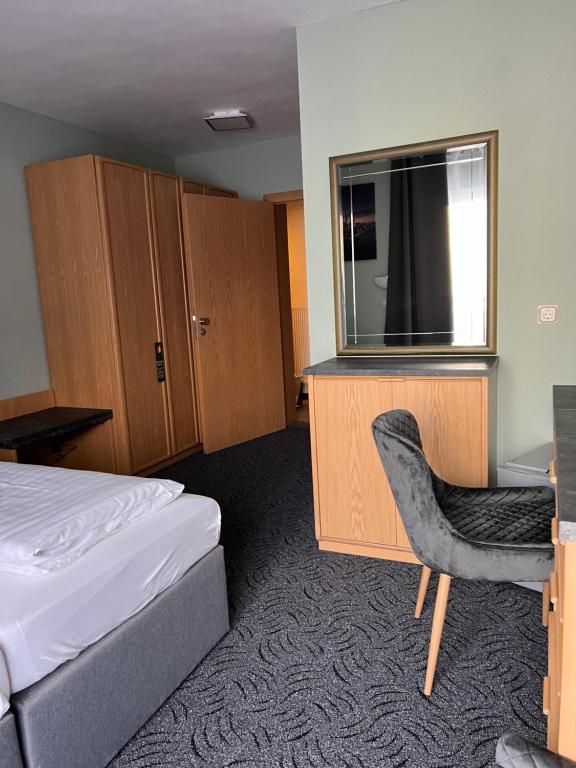 Postel nebo postele na pokoji v ubytování Hotel Aggertal