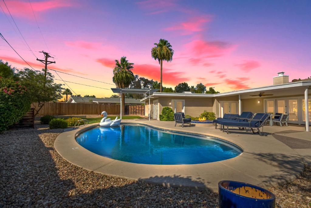 a swimming pool in the backyard of a house at Mountain Serenity-Private Pool-Old Town Scottsdale in Scottsdale