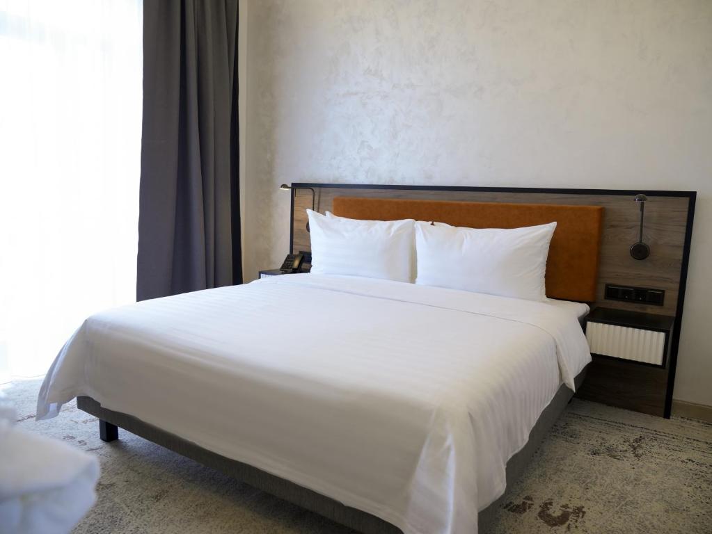 Кровать или кровати в номере Eighty Eight Deluxe Hotel & Spa