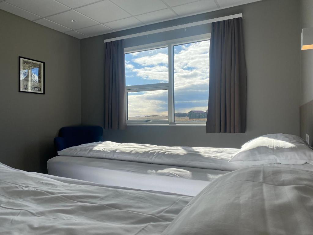 Postel nebo postele na pokoji v ubytování Vagnsstadir Guesthouse