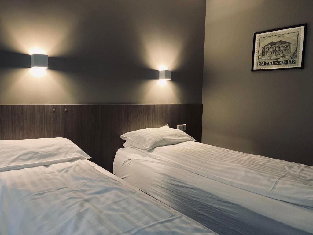 Postel nebo postele na pokoji v ubytování Vagnsstadir Guesthouse