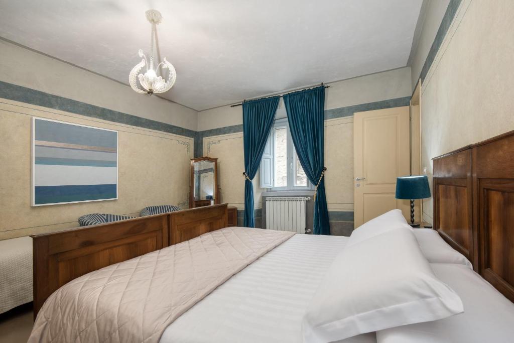 Postel nebo postele na pokoji v ubytování Asso Residence Narni