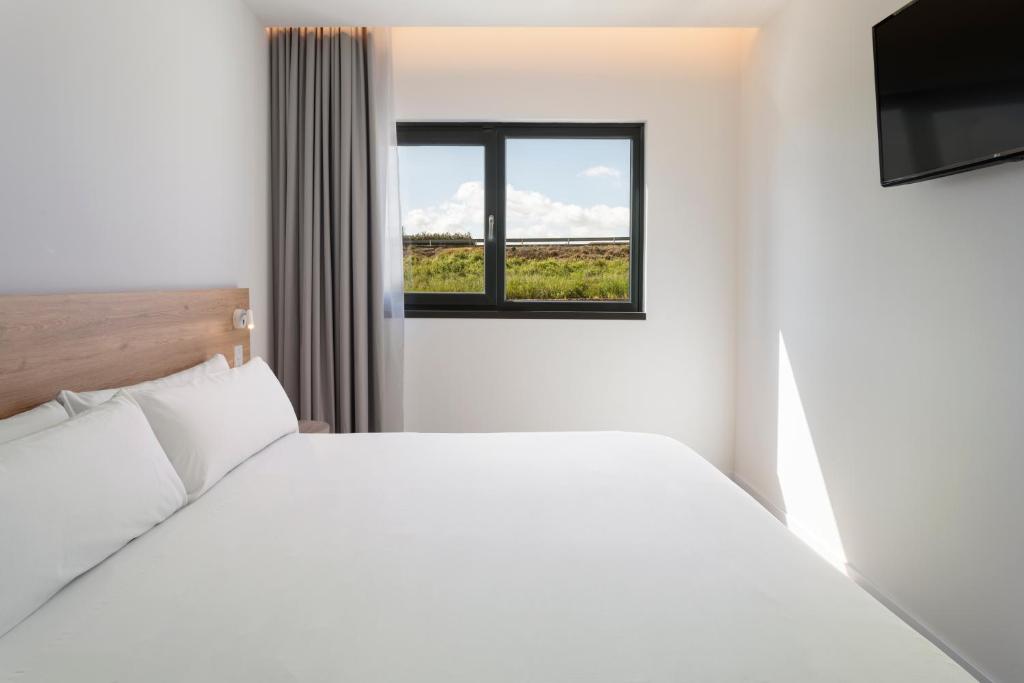 Postel nebo postele na pokoji v ubytování B&B HOTEL Écija