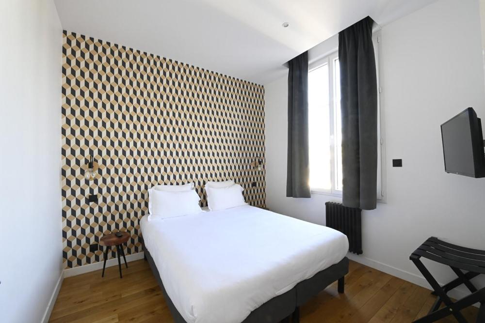 Postel nebo postele na pokoji v ubytování Manoir de l'évêché et Spa