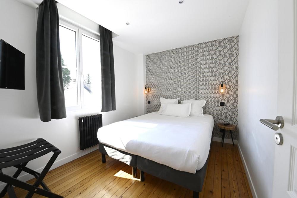 Postel nebo postele na pokoji v ubytování Manoir de l'évêché et Spa