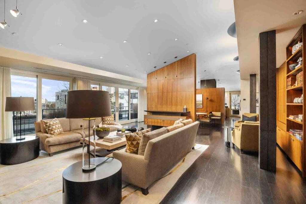 a large living room with a couch and a table at Crane Penthouse in Portland