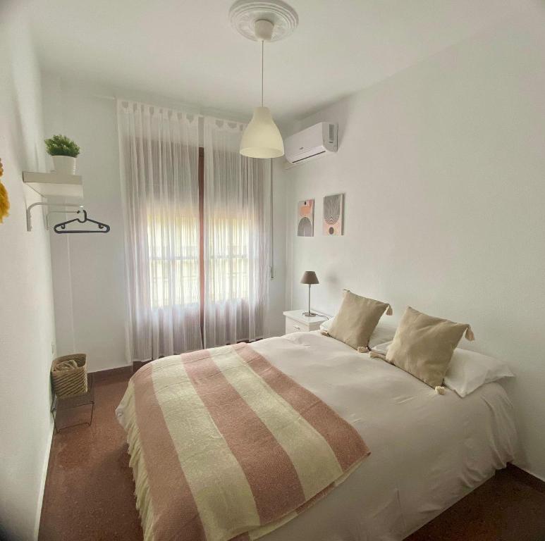 Postel nebo postele na pokoji v ubytování Vera Apartment, acogedor y tranquilo en el corazón de la ciudad