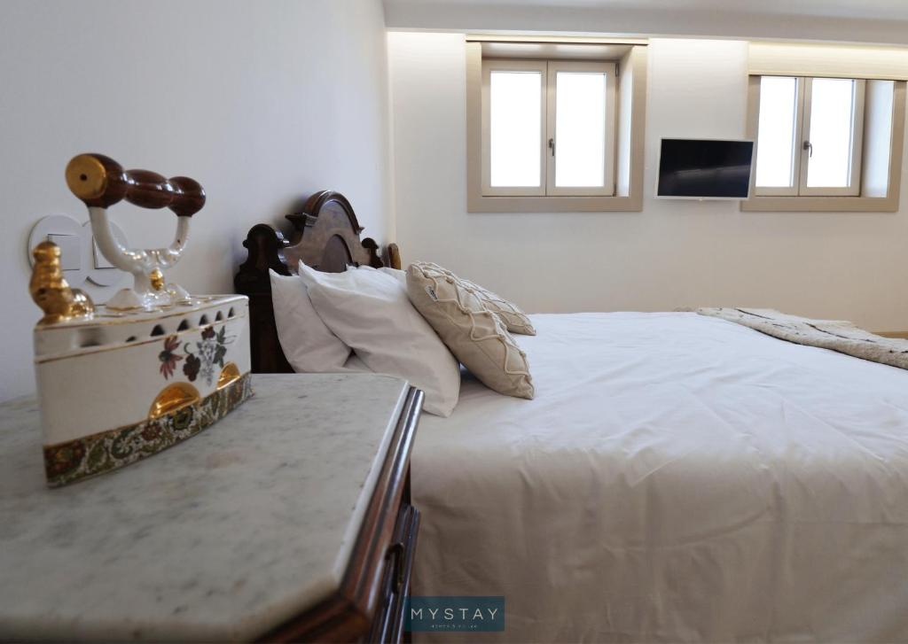 Postel nebo postele na pokoji v ubytování MyStay - Casa Matriz Séc XVI