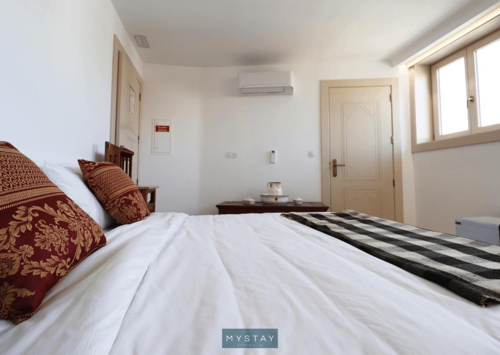 Postel nebo postele na pokoji v ubytování MyStay - Casa Matriz Séc XVI
