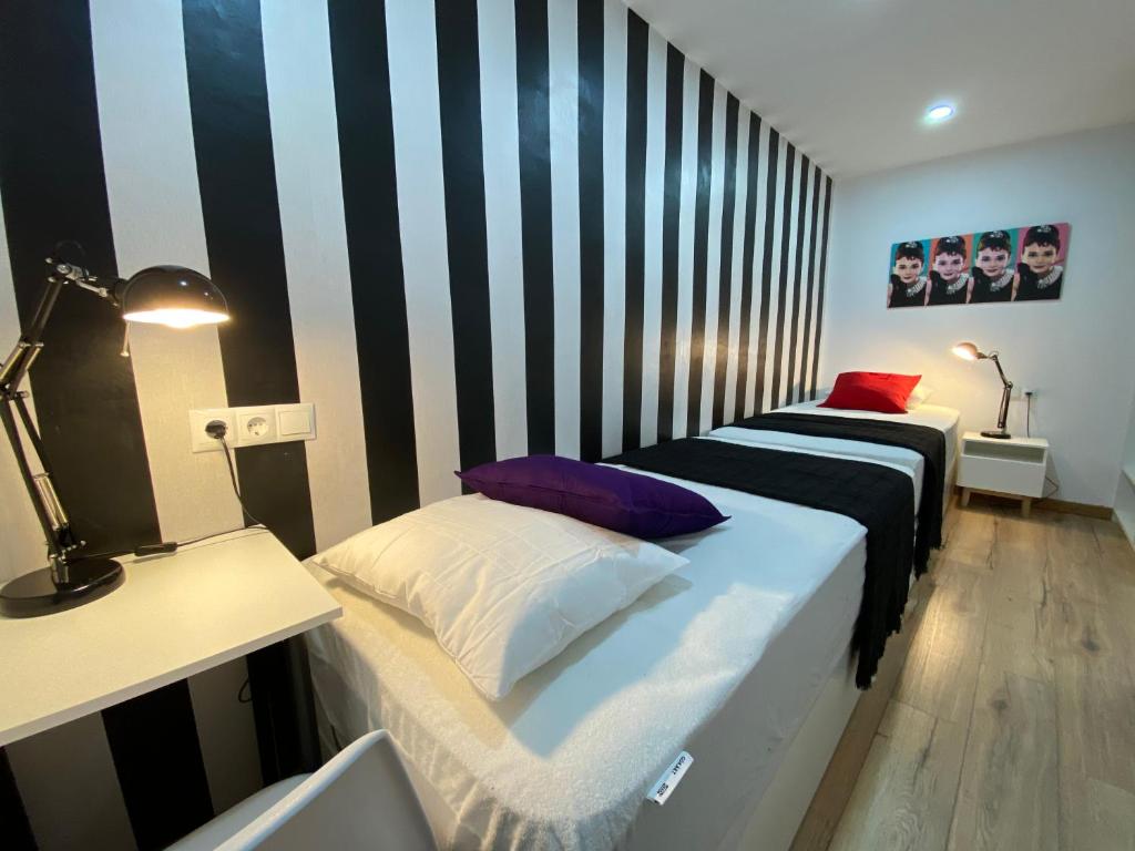 A bed or beds in a room at Besos Beach Gem II By MyRentalHost
