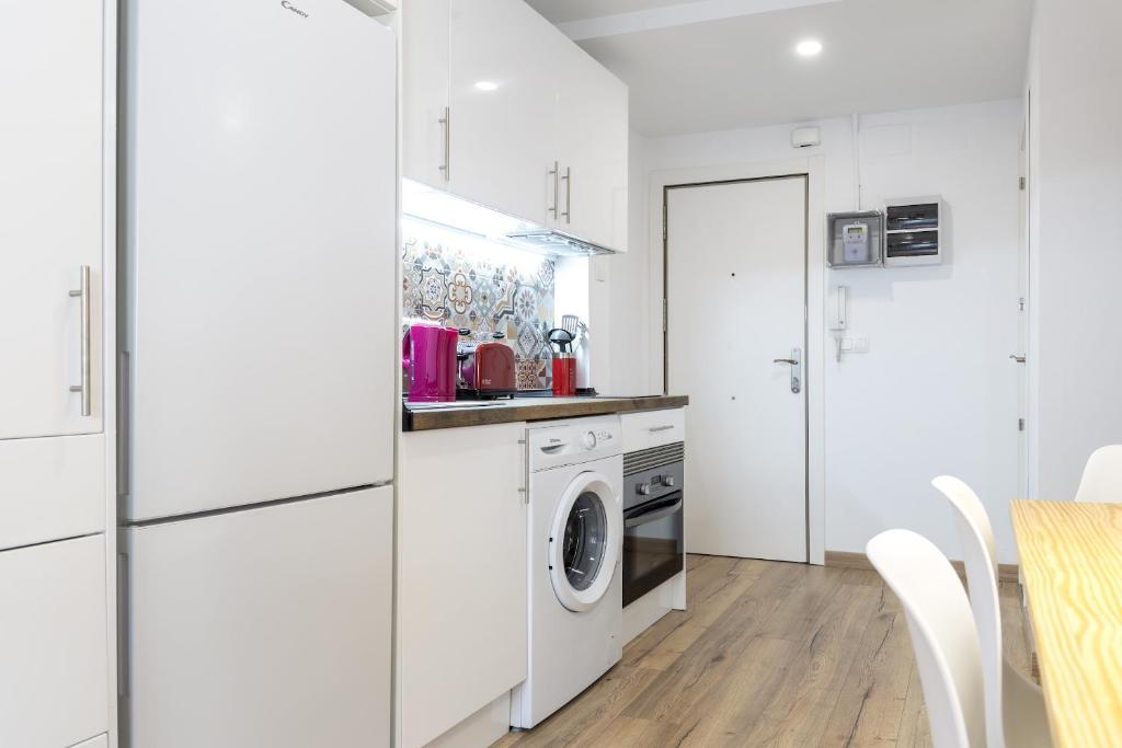 A kitchen or kitchenette at Besos Beach Gem II By MyRentalHost