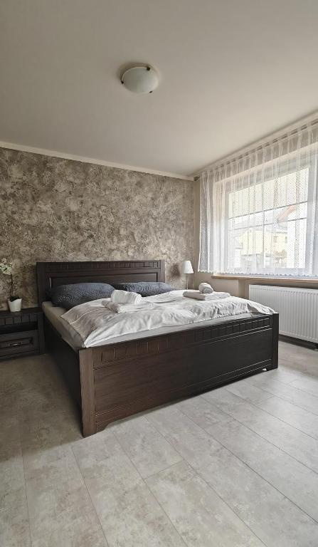 Postel nebo postele na pokoji v ubytování Apartmá Kanada