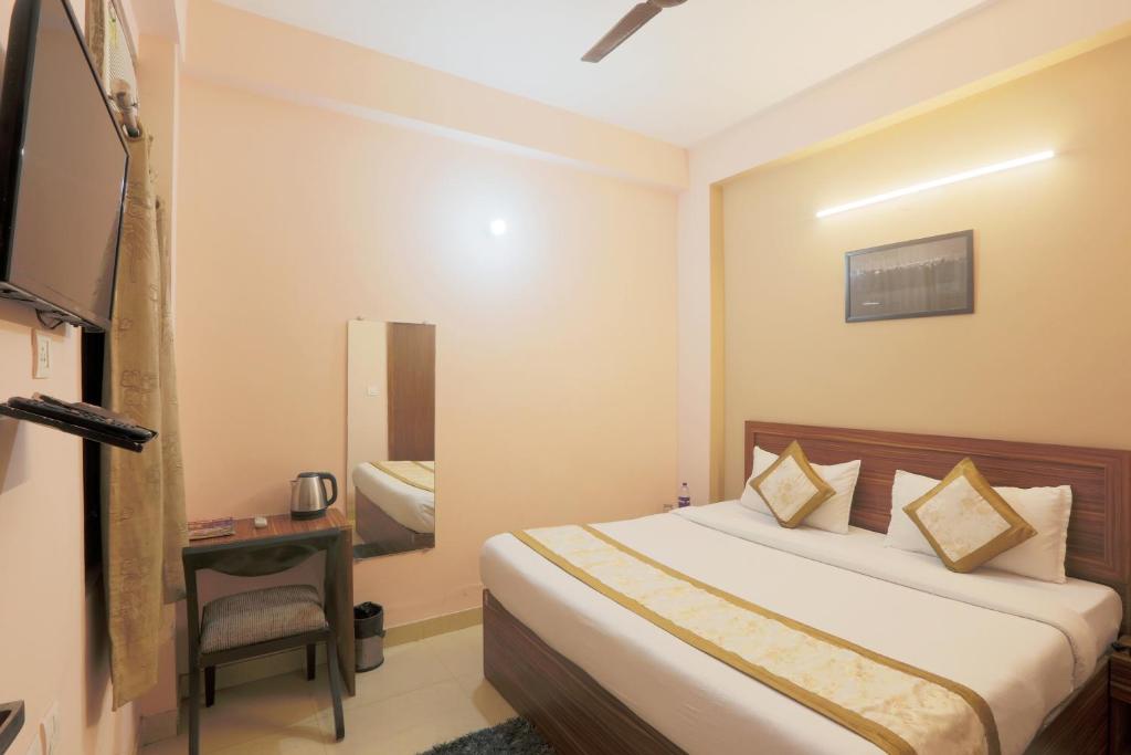 Postel nebo postele na pokoji v ubytování Hotel Ginger Palace - Corporate Hotel Noida Sector 62