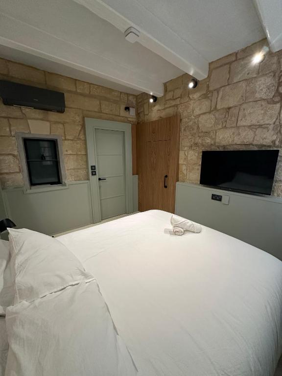 Postel nebo postele na pokoji v ubytování Lorenzo x Casa Norte