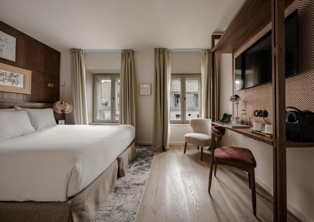 Postel nebo postele na pokoji v ubytování Hotel Pulitzer Paris