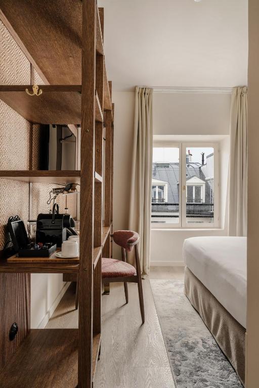Postel nebo postele na pokoji v ubytování Hotel Pulitzer Paris