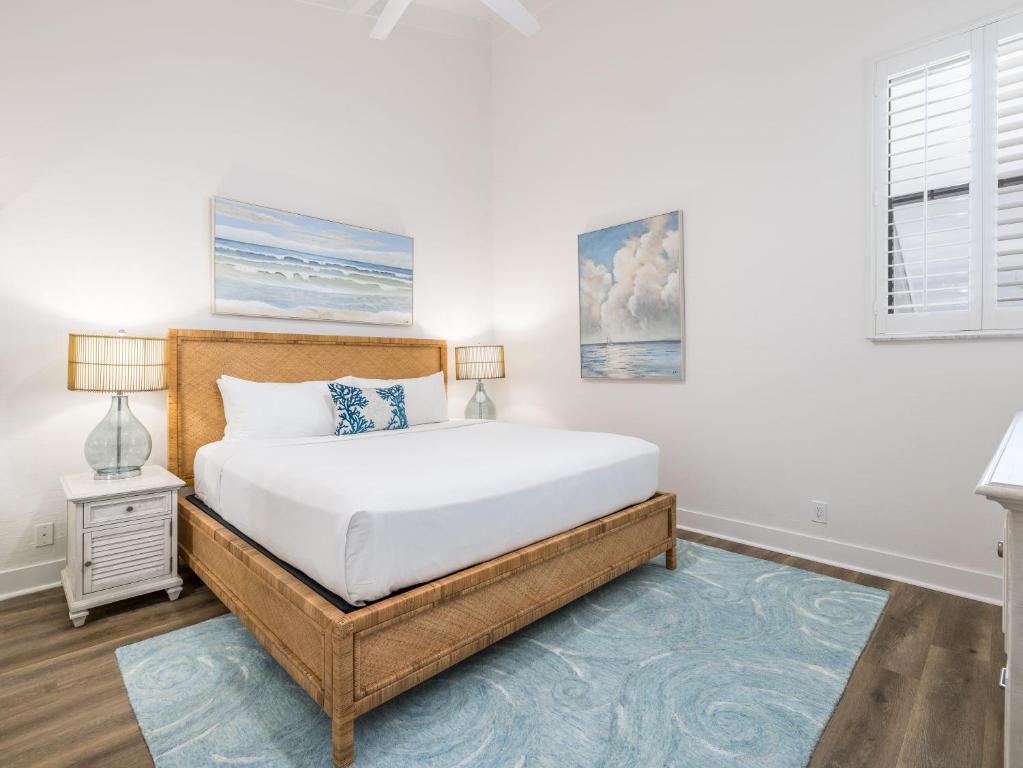 a bedroom with a bed and a window at South Seas Resort - Official Site in Captiva