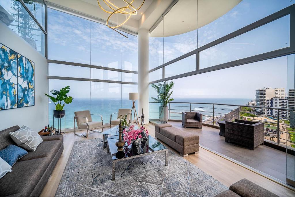 a living room with a view of the ocean at Luxury Ocean View Penthouse with Pool in Miraflores in Lima