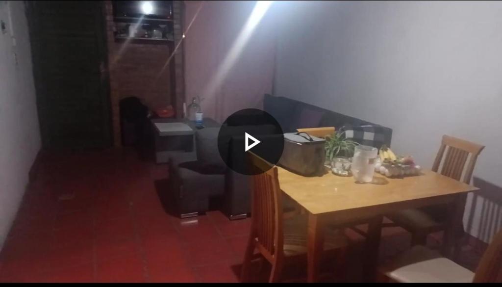a room with a wooden table and a table and a table at Casa del Sur Querétaro in Casa Blanca La Corregidora