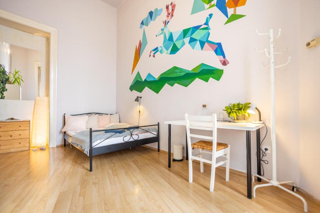 A bed or beds in a room at Gellerico Rooms at Rákóczi Square