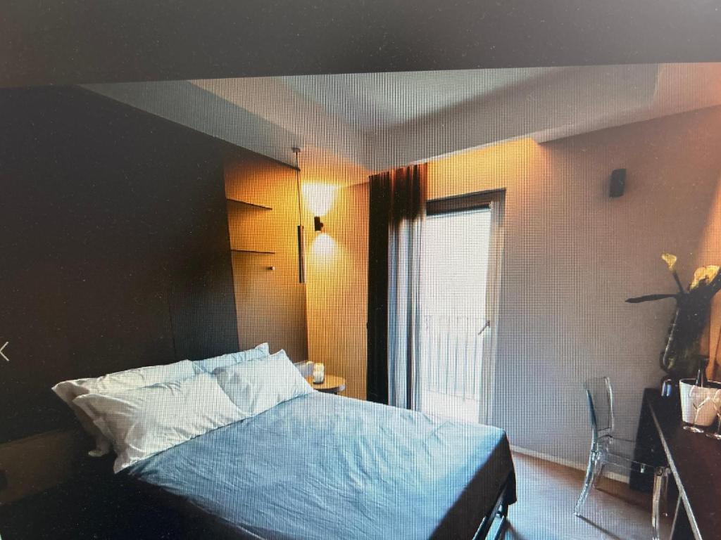 Postel nebo postele na pokoji v ubytování Nicanto Rooms