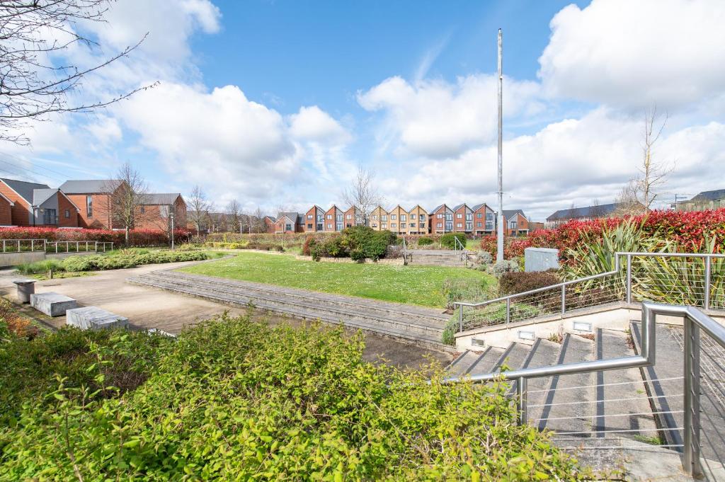 a view of a park with houses in the background at THE RISE - A beautiful 2 bedroom house, only 17mins to Central London!!! in Northfleet