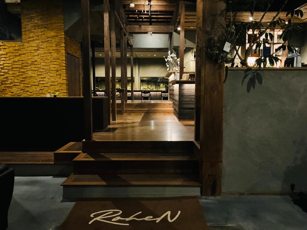 a lobby of a restaurant with stairs and a sign that says raisin at RoheN HakoneYumoto in Hakone