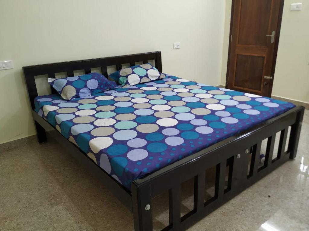 Ліжко або ліжка в номері Anithaas Cottage
