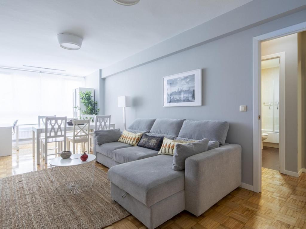 a living room with a couch and a table at Apartamento Vigo, 3 dormitorios, 7 personas - ES-210-3 in Vigo