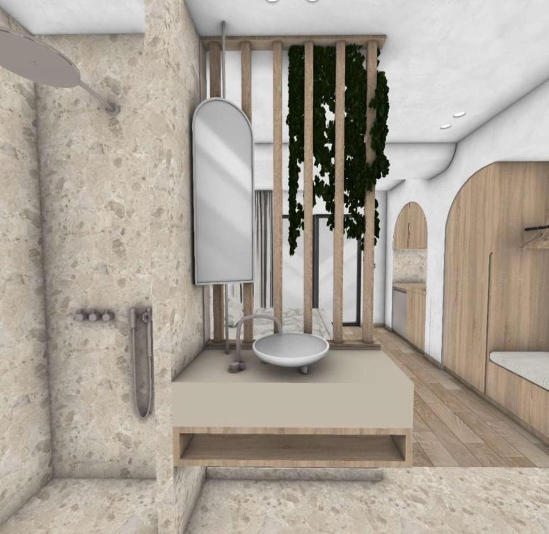 ein Bad mit einem Waschbecken und einem Spiegel in der Unterkunft Roula Kotsonis Superior Apartment in Argassi