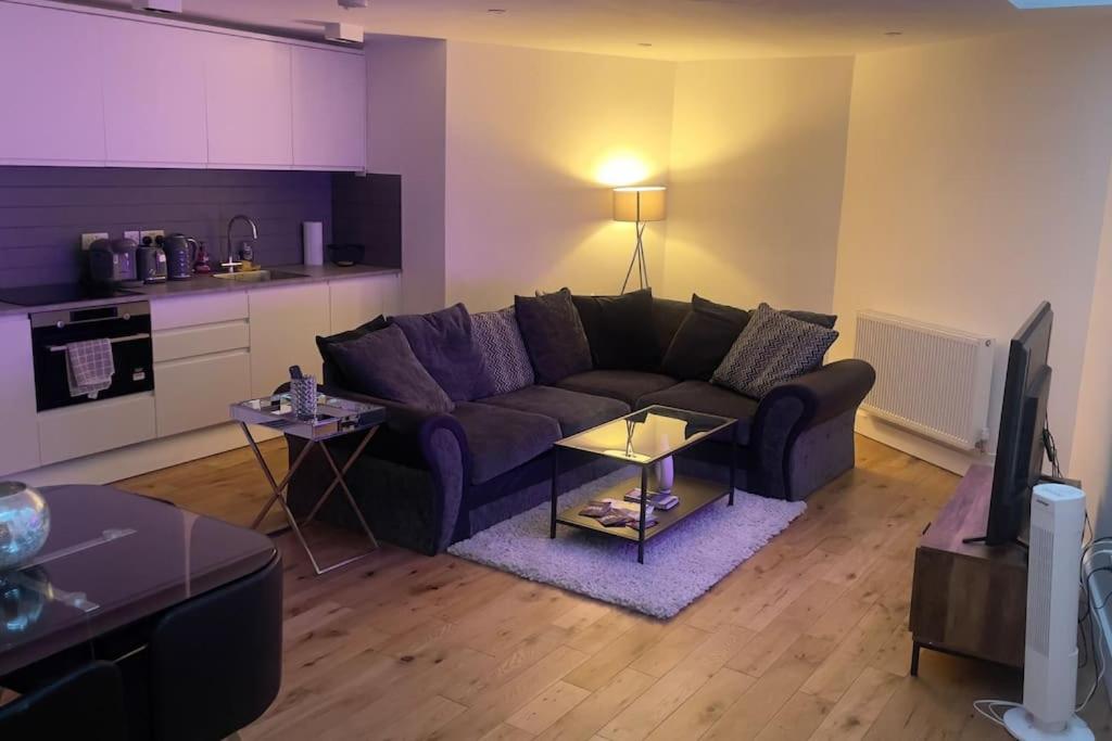 a living room with a couch and a table at Bank/Monument apartment in London