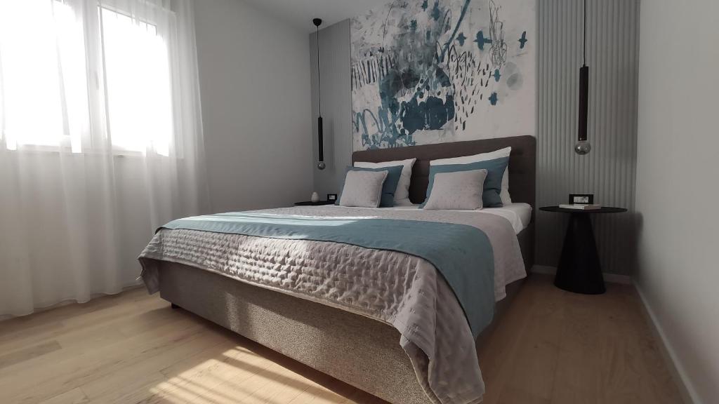 Posteľ alebo postele v izbe v ubytovaní Apartman Spalatum