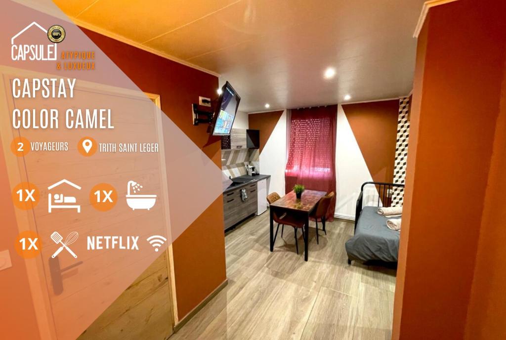 a room with a kitchen and a room with a table at Capstay Color Valenciennes & Netflix in Saint-Léger