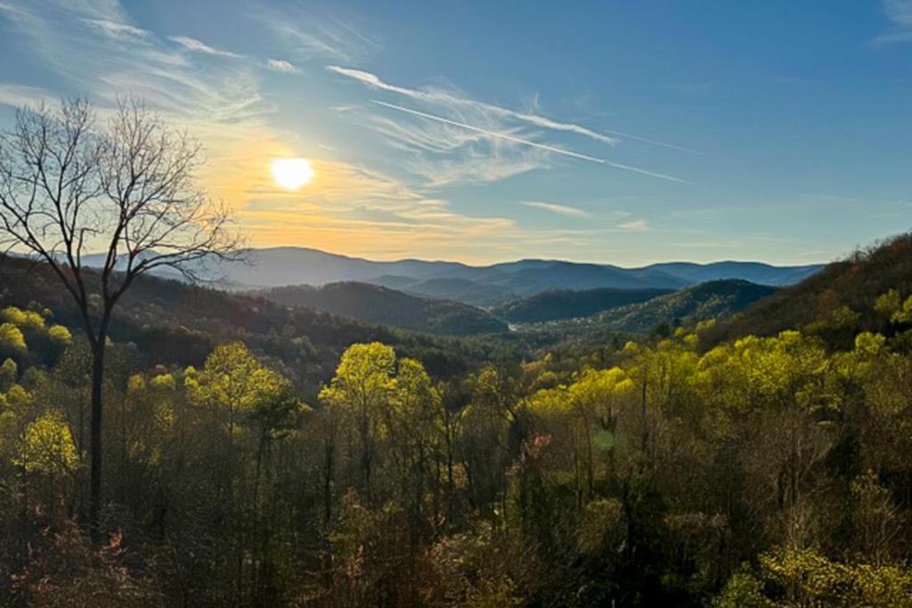 a view of a valley with the sun in the sky at Skyridge in Blairsville