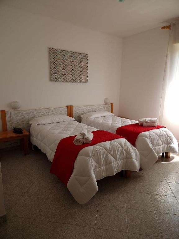 Postel nebo postele na pokoji v ubytování Hotel Mistral