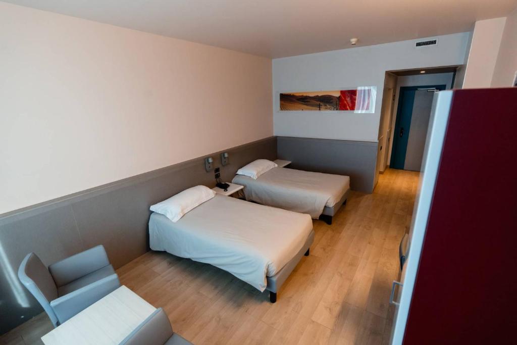 Postel nebo postele na pokoji v ubytování Hotel Ristorante I Castelli