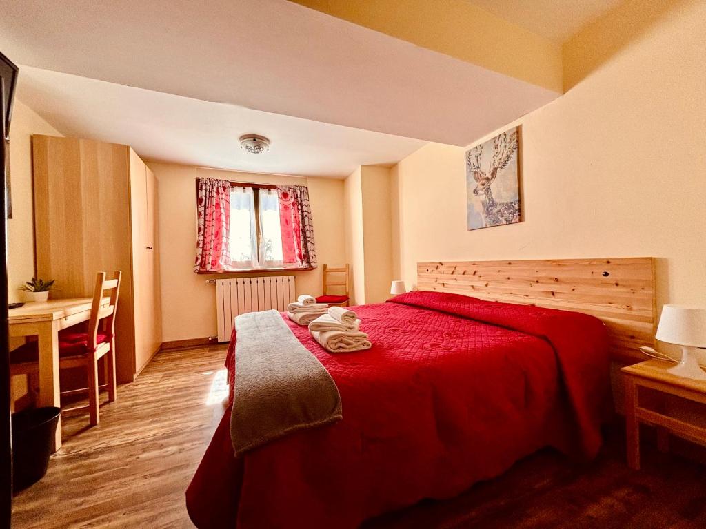 Postel nebo postele na pokoji v ubytování Hotel Piccolo Chalet
