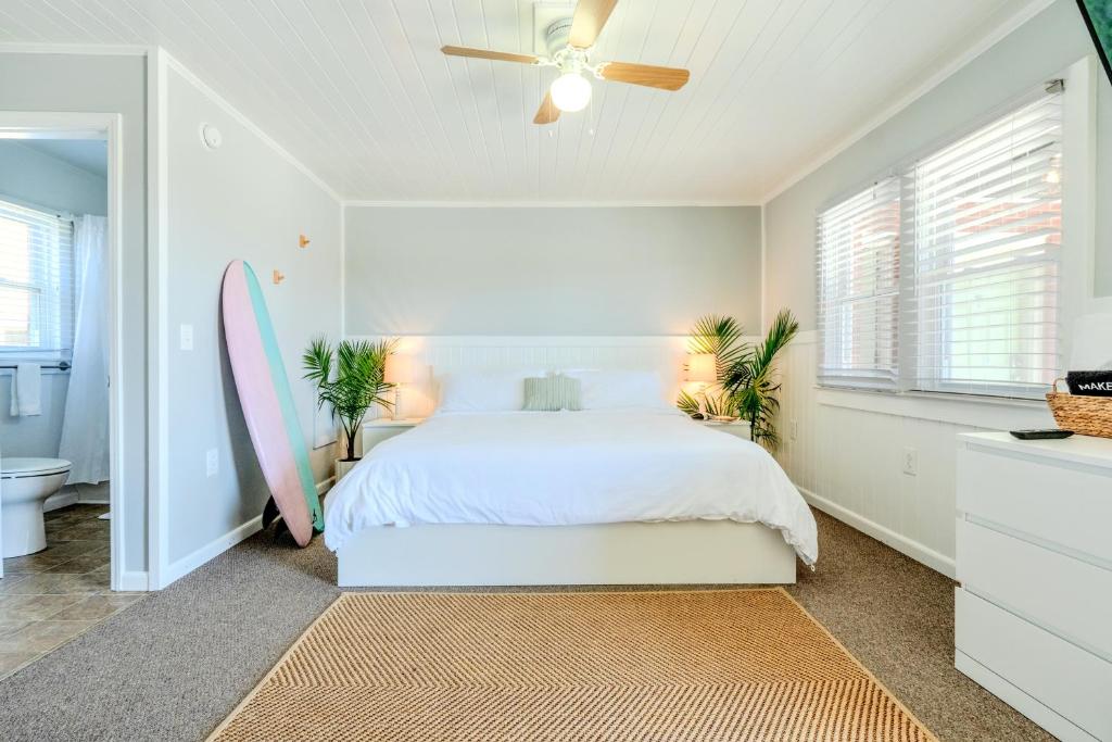 a bedroom with a bed with a surfboard in it at Tower Circle Motel in Buxton