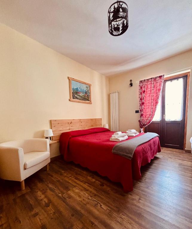 Postel nebo postele na pokoji v ubytování Hotel Piccolo Chalet