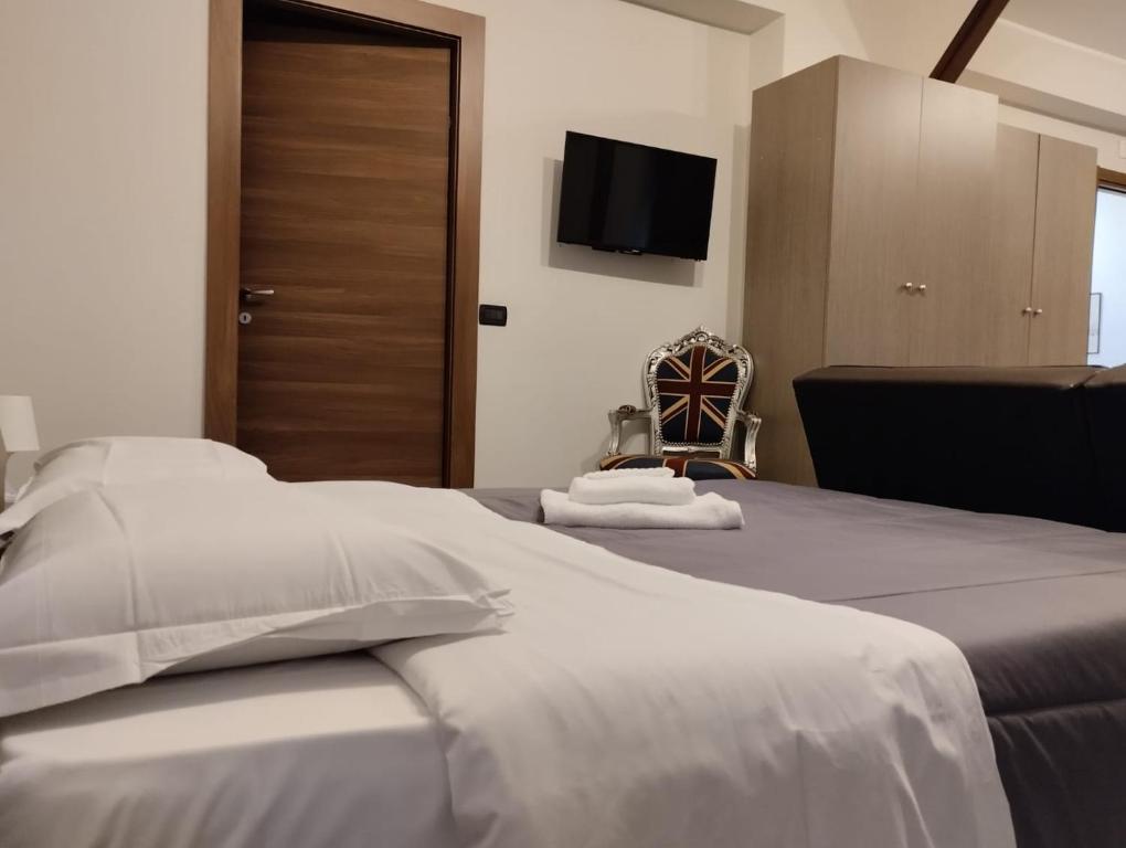 Łóżko lub łóżka w pokoju w obiekcie Calipso Bed&Breakfast