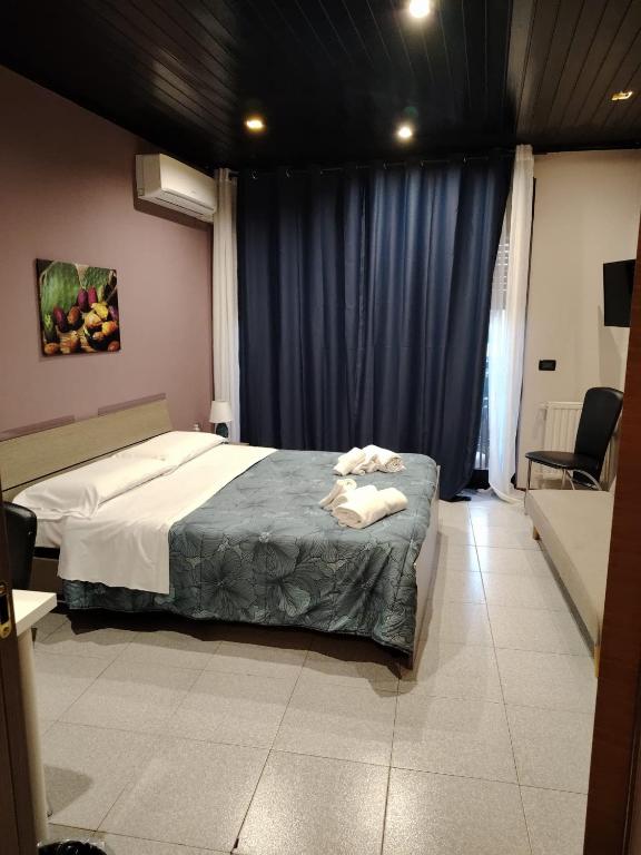 Łóżko lub łóżka w pokoju w obiekcie Calipso Bed&Breakfast