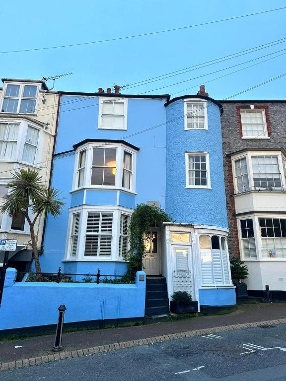 a blue house on the side of a street at Tower House, Cowes Old Town in Cowes